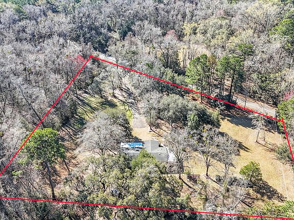 More of the property from the rear, showing Cherokee Farms Road in the front.