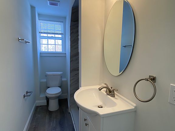 Bathroom with shower stall and window