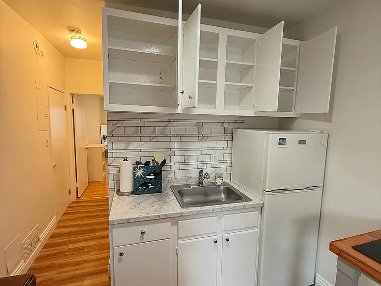 NEWLY PAINTED WHITE WOOD CABINETS !!