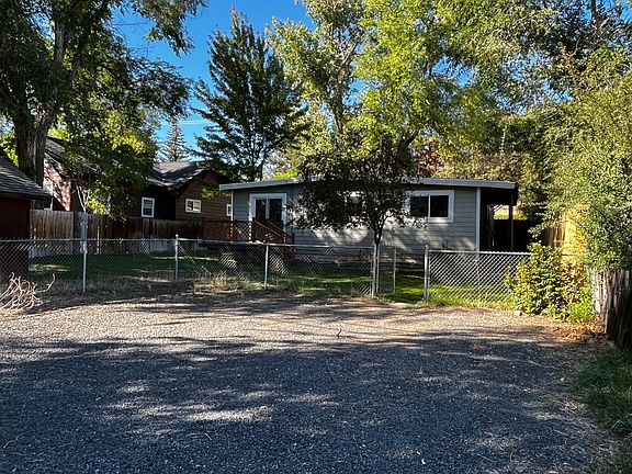 Rear of House & Parking Area. Deck off of master bedroom.