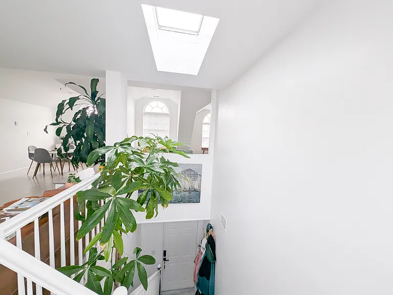 View into apartment door and staircase