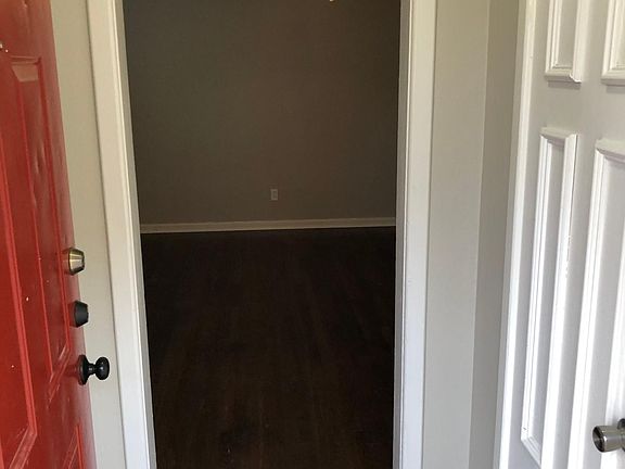 Entryway with coat closet.