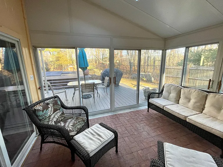 Sun Room #2 offers ground-level access to the deck and pool as well as the garage - 16' x 13'