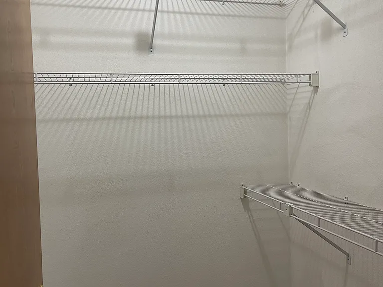 Walk-in closet in main bedroom.