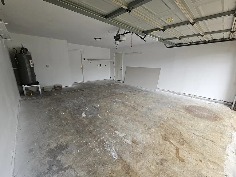 Garage, entry to house and door to back yard