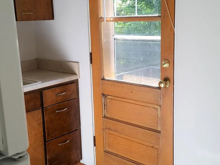 Walkout from the kitchen to your own private, fenced brick patio (private entrance)