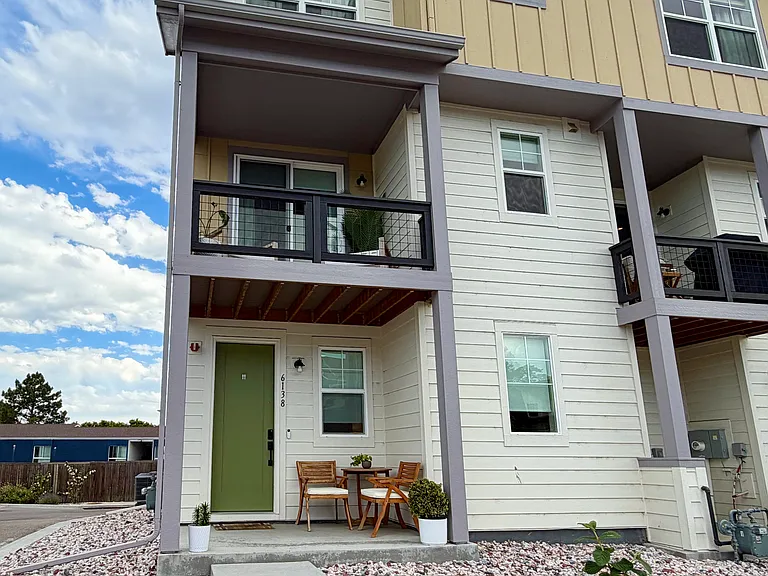 Front of house, end unit with windows on 3 sides.
