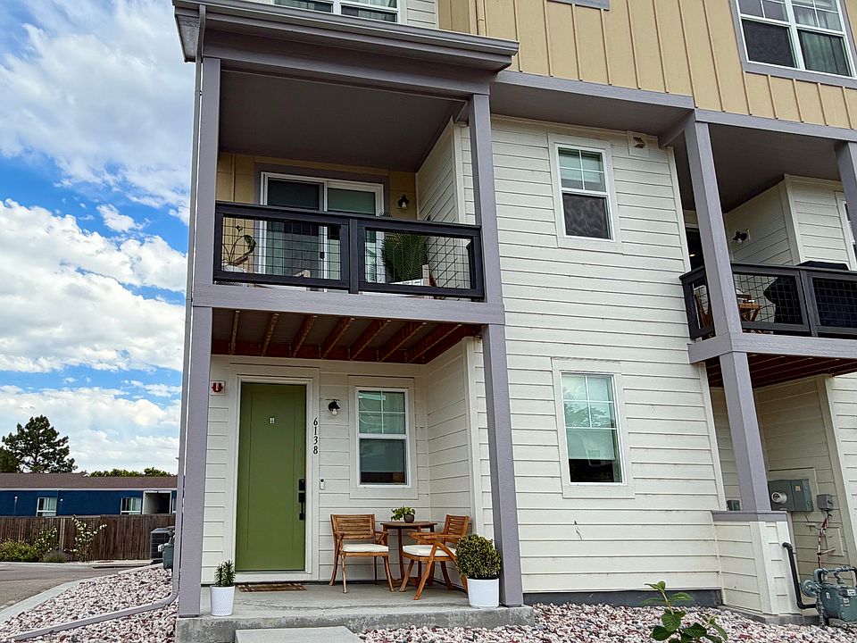 Front of house, end unit with windows on 3 sides.