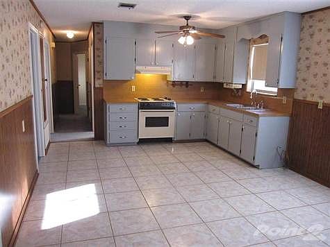 Wall space for buffet or isl. Window view to bk yd