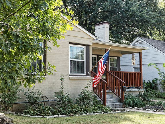 A well maintained yard and flowerbed draws your eyes to the front porch. A perfect spot to greet guests or just sit for a spell!