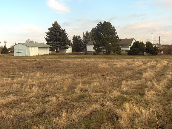 View from SW back corner of the property, barn is on left