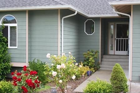 Mature landscaping surrounds the home.