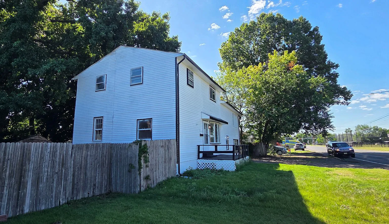 Freshly Updated 6-Bedroom Home with Yard & Driveway — Photo 3