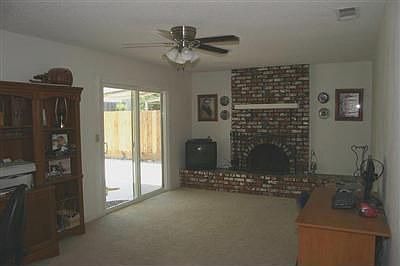 Beautiful Den with Wood Fireplace