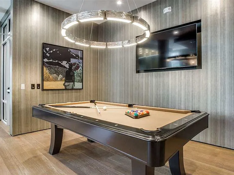 Game room with TVs for entertaining.
