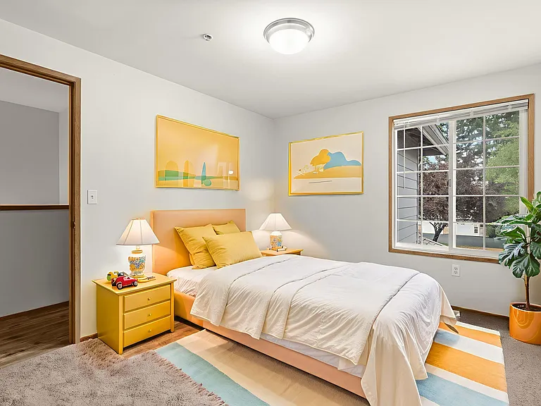 Cheerful kids' bedroom, virtually staged with playful colors, cozy bedding, and a bright, inviting layout. Cheerful kids' bedroom, virtually staged with playful colors, cozy bedding, and a bright, inviting layout.