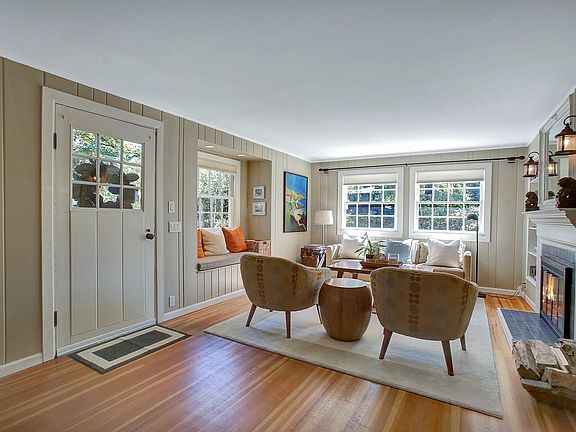Entry way and living room with wood burning fire place