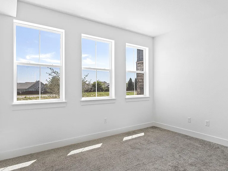 Light & Airy Secondary Bedroom Suite on 1st Floor w/ Oversized Windows.