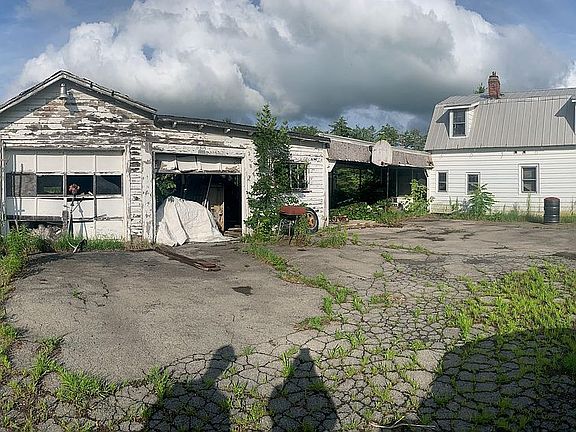 Garage, with caved-in roof.