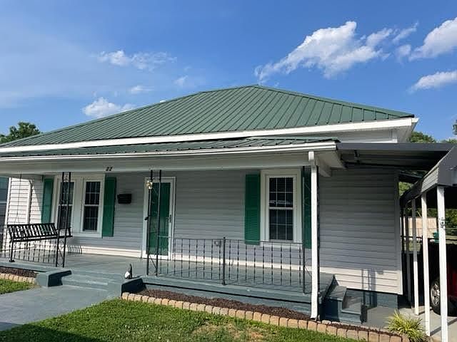 Great curbside appeal that includes front porch swing.