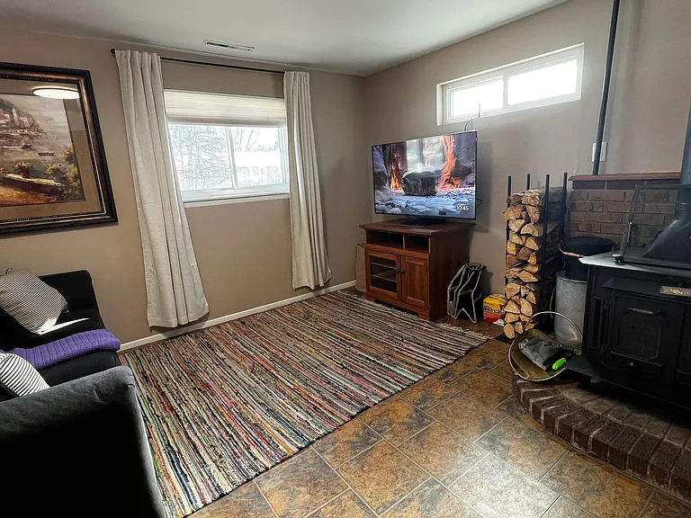 Second living room with a 55" smart TV, perfect for movie nights or giving everyone their own space to unwind.