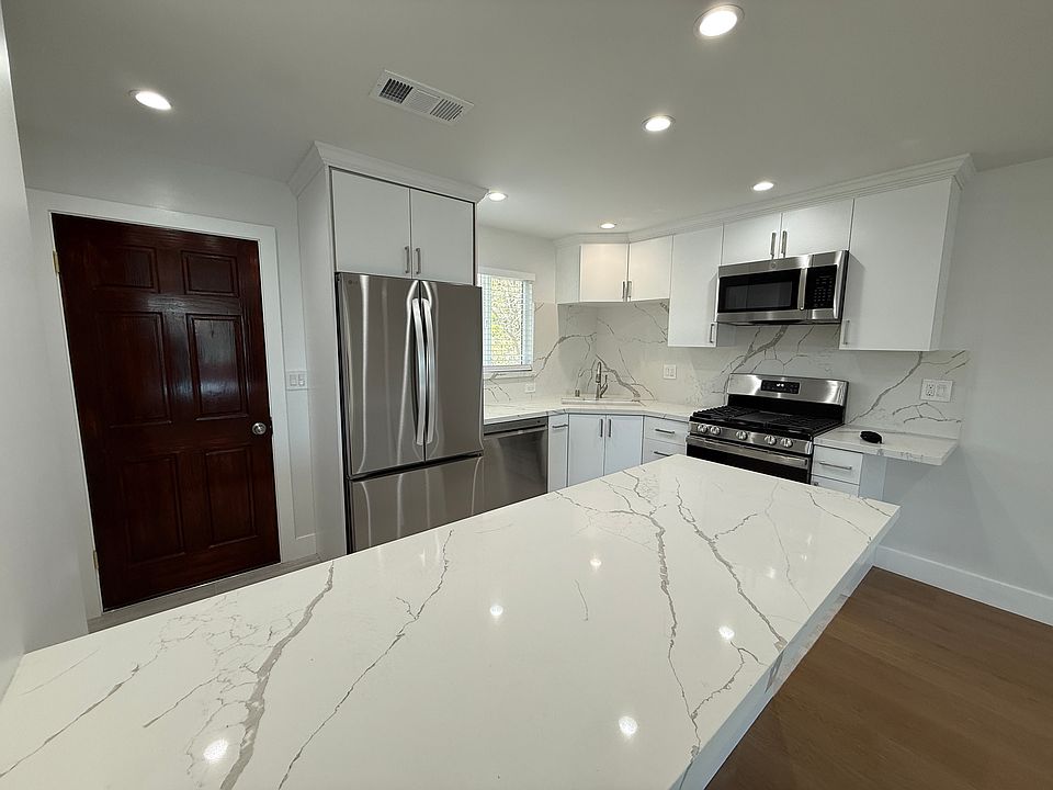 Kitchen with huge island, room for at least 5 barstools