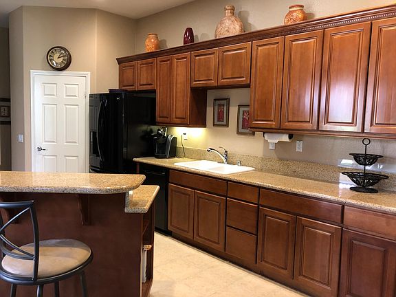 Kitchen area and 2 Stools