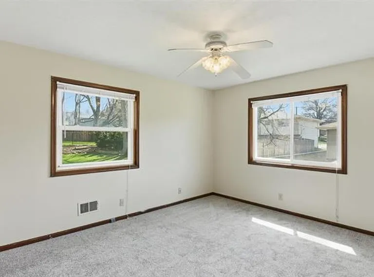 Primary bedroom with double windows