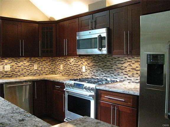 Stunning Cherry Cabinetry and Top of the Line GE Cafe' Appliances make this kitchen one of a kind!