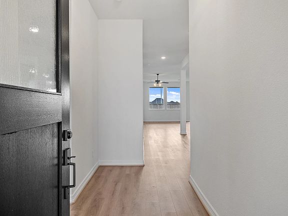Feel at home from the start-an inviting entryway leads you into the heart of the open living area.