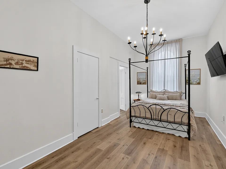 The Magnolia, a beautifully furnished private bedroom with its own private bathroom and TV.