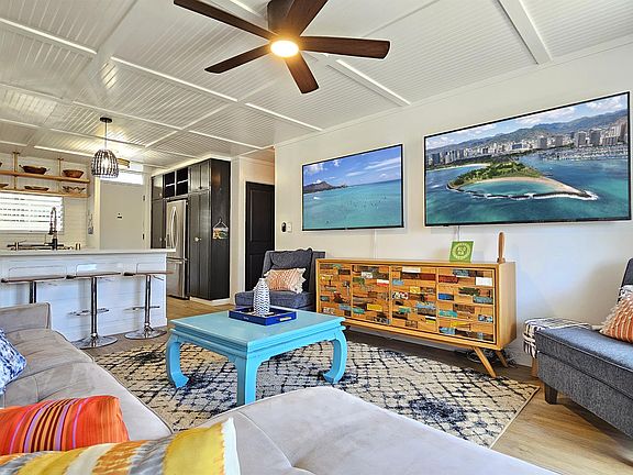Spacious Living Room, with plenty seating and two big screen TV's