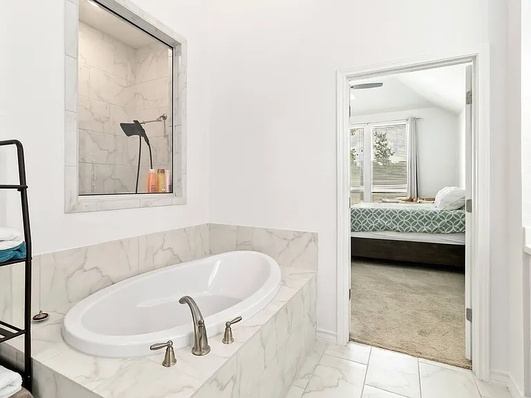 Master bathroom with shower and huge tub