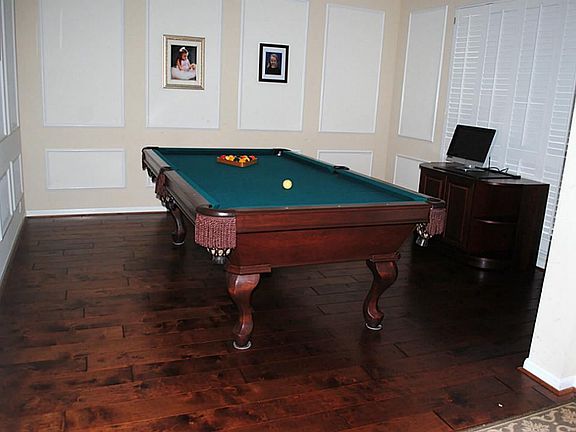 Across the entry is the formal living room, but this room has so many options for your family.