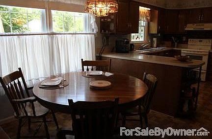 Kitchen
						:
						Breakfast nook overlooks outside patio.