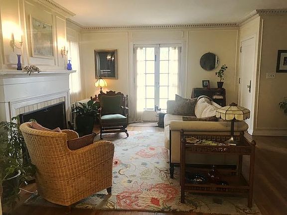 Spacious living room with wood-burning fireplace