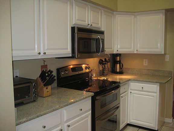 Bright, contemporary kitchen with brand new granite countertops