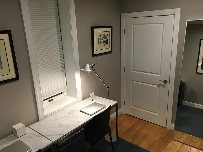 Walk-in closet with Elfa storage unit