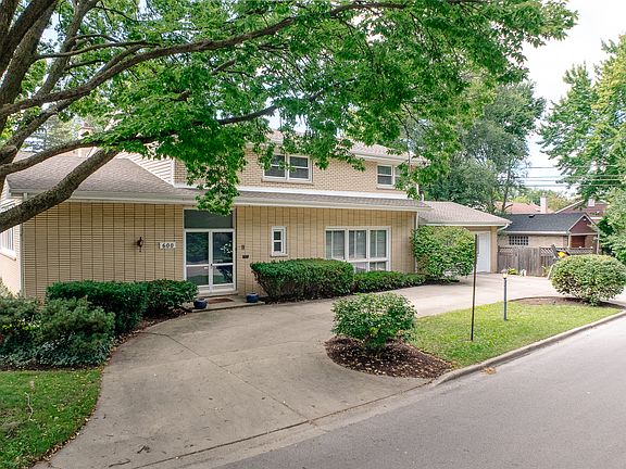 Corner lot with fenced in backyard and horsechoe driveway.
