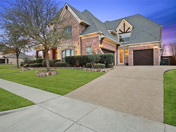 Swing 3 Car Garage with access to interior.  There is a conveniently located Mudroom with quick access to the exterior.  Pebble Gravel Aggregate Front Entry Walk Way and Driveway.