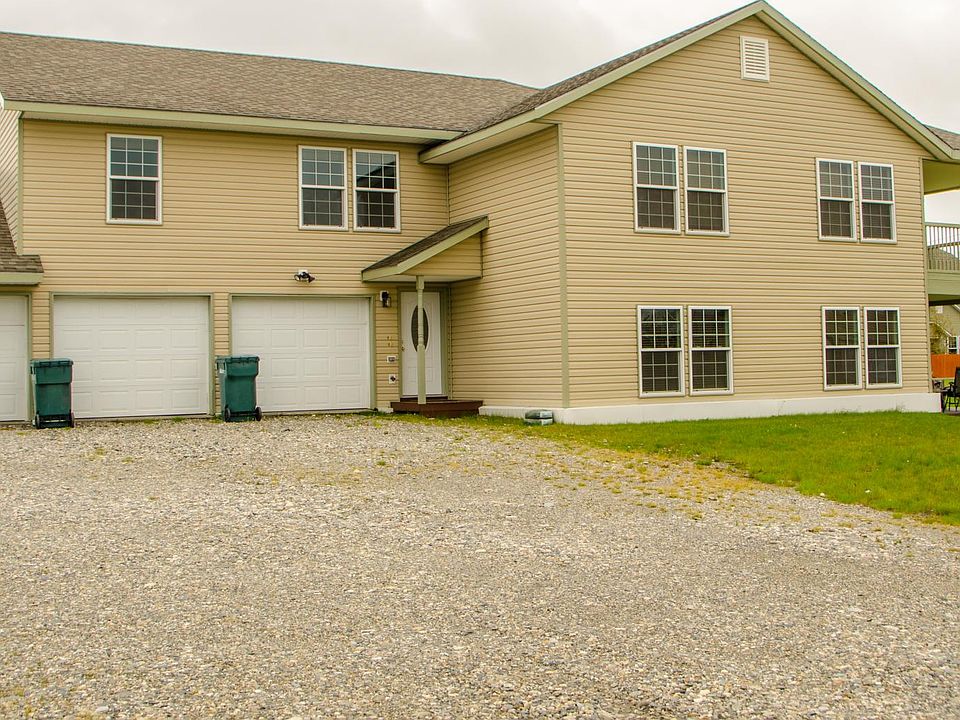 Bright upstairs unit with two garage spaces included