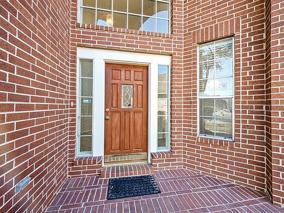 BEAUTIFUL BRICK ENTRY WAY ALONG WITH MANY OTHER SPECIAL FEATURES INSIDE INCLUDING TONS OF STORAGE AND CABINET SPACE.