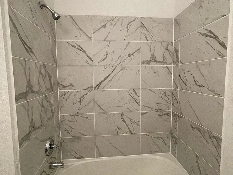 Second bathroom with bath tub