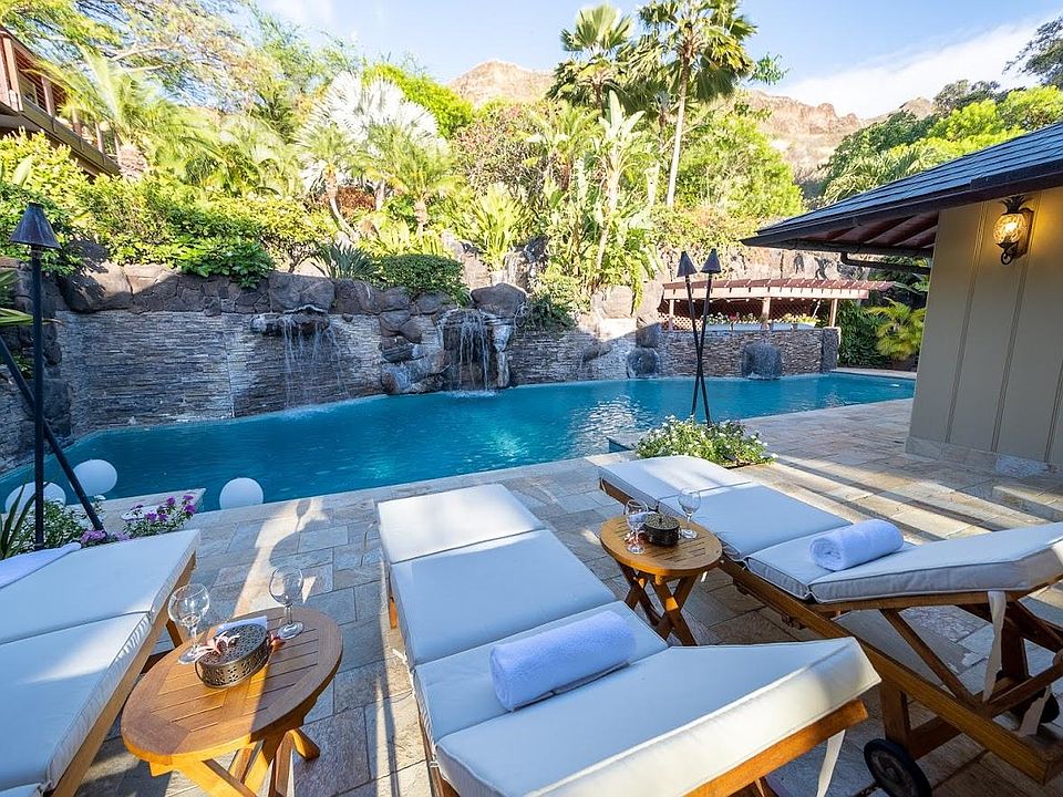 Relax poolside with spectacular views of Diamond Head