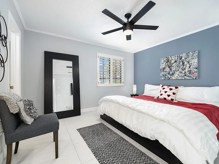 Guest room with King bed and smart TV with private bath and walk in closet.