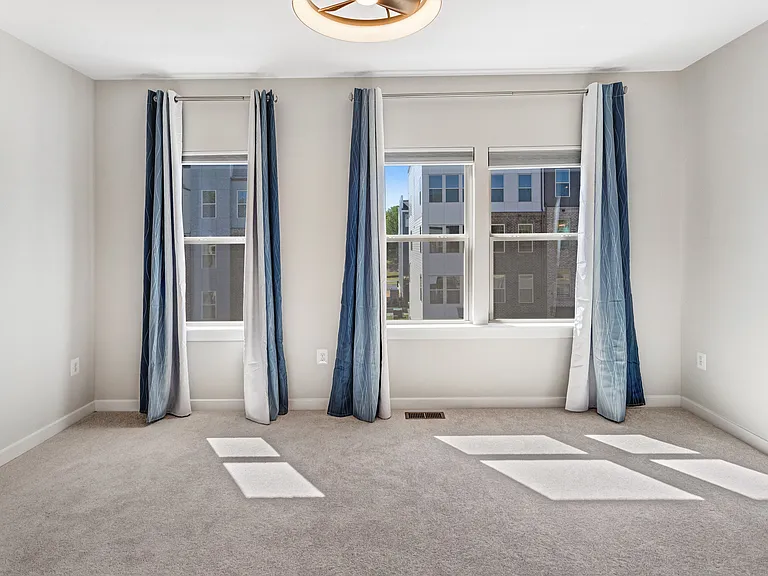 Generously sized primary bedroom designed for comfort, relaxation, and privacy.