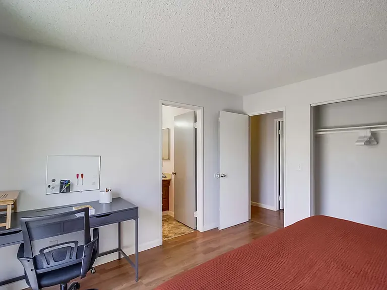 Room with a king bed and a spacious closet for all your storage needs.