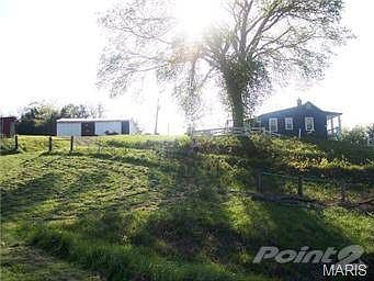 SIDE OF HOUSE FROM POND