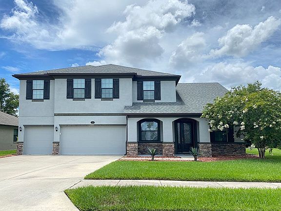 Jeppeson French Country with opt stone new home front exterior William Ryan Homes Tampa