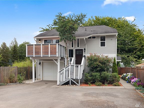 Single car garage can be used for projects with all this parking space.  And look at those hydrangeas.